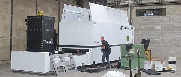 Brand new laser cutter being installed in IPI's metal shop