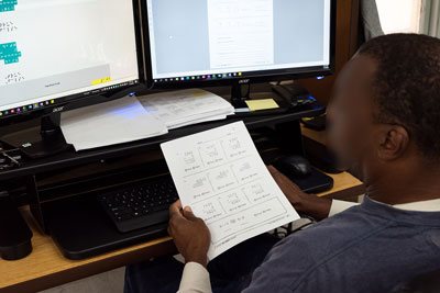 Inmate transcribing a grade-level mathematics worksheet