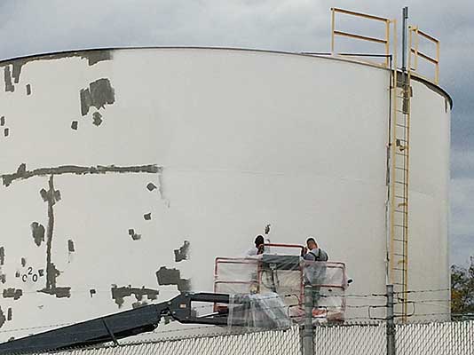 Workers working on the DAS fuel tank paint project