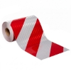 Roll of red and white diagonally-striped reflective sheeting.