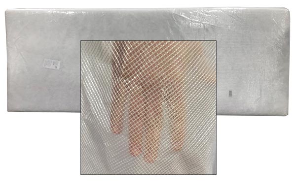 White mattress pad with a close-up inset showing a hand behind the durable mesh cover material.