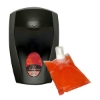 Black wall-mounted soap dispenser alongside a refill pouch of orange Lavish foaming hand soap.