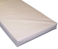 Off-white mattress with a flat, smooth, wipeable cover on a white background.