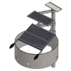 3D CAD rendering of a round metal fire ring featuring dual-tiered swivel cooking grates, a utility shelf, and an in-ground support post.